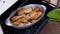 A Woman Takes Out Cooked Juicy Fried Chicken Legs from the Oven. Zoom. Close up