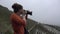 Woman takes a photo during her tour of Ping An