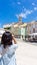 Woman takes photos of Tartini Central Square in Piran. Piran, Obalno-kraska, Slovenia, June 2020