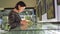 a woman takes pictures of exhibits in a museum. cute brunette 30 years old