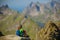 Woman takes rest on top of mountain in Norway