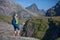 Woman takes rest on top of mountain in Norway