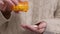 Woman takes vitamins. Woman pours pills into the palm