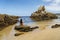 Woman taking a bath at a paradise empty beach