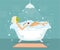 Woman taking a bubble bath in a vintage bathtub