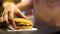 Woman taking cheeseburger from table, dinner in fast food restaurant, snack bar