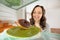 Woman Taking Chocolate Donut From Refrigerator