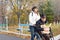 Woman taking a disabled man grocery shopping