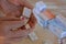 Woman taking medication from a pill box