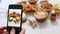 Woman taking photo of chinese style, deep fried, battered chicken