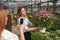 Woman taking photo on chrysanthemums