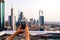 Woman taking photo of Dubai cityscape