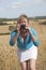 Woman taking a photo of farmland