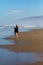 Woman taking photo of the pacific ocean in Oregon with her smartphone