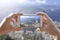 Woman taking a photo of Rio de Janeiro.