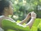 Woman Taking Photograph Of Leaves