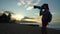 Woman taking photos on hawaiian beach Haleiwa, North shore, Oahu. Summer travel holidays vacation getaway on Hawaii, USA