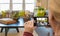 Woman Taking Photos of A Living Room in Model Home with Her Smart Phone