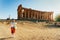 Woman taking photos of Temple of Concordia Agrigento Sicily island