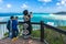 Woman taking picture of beautiful tropical lagoon with her smart