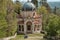 Woman taking picture of her family along the path of the historic pilgrimage route from Sacred Mount or Sacro Monte of Varese,