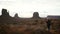Woman taking pictures in Monument Valley with a camera.