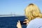 Woman taking pictures at Oresund Bridge