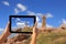 Woman taking pictures on a tablet lighthouse