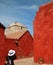 Woman taking pictures of vivid color buildings in Santa Catalina Monastery, Arequipa, UNESCO World Heritage Site, Peru