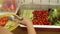 Woman taking salad bar in buffet