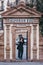 Woman taking a selfie by the entrance to Alfonso XIII uxury hotel in Seville, Spain