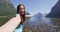 Woman taking selfie video having fun on travel in New Zealand, Milford Sound