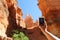 Woman taking smart phone picture of Rock Hoodoos in Bryce Canyon National Park