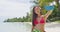 Woman taking smart phone selfie video - Bikini travel beach girl using smarphone