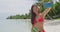 Woman taking smart phone selfie video - Bikini travel beach girl using smarphone