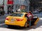 Woman taking taxi on fifth avenue in Manhattan