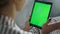 Woman talking online green tablet screen closeup. Hand waving making video call