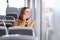 Woman talking on the phone while riding the bus, train or metro