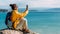 A woman is talking by video link against the background of the sea. A traveler on the seashore, panorama