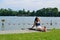 Woman tanning on the lake