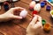 A woman with a tassel paints Easter eggs. Preparing decorations for Easter, creativity with children, traditional symbols.