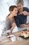 Woman tasting cake preparation