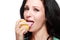 Woman tasting lemon
