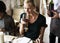 Woman Tasting Red Wine in a Classy Restaurant