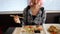 Woman tasting salmon sashimi