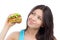 Woman with tasty fast food unhealthy burger in hand to eat