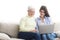 Woman teaching mother how to use laptop computer