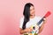 Woman teen confident smiling face hold acoustic Ukulele guitar