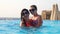 Woman and teen girl, mom and daughter, in funny, identical, round sunglasses, relax, have fun in outdoor pool with