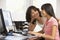 Woman And Teenage Daughter Using Computer
